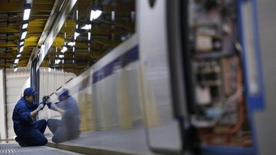 An employee works on a high-speed train model CRH380B at a final assembly line of Tangshan Railway Vehicle’s factory in Hebei province, China. Kim Kyung-Hoon / Reuters