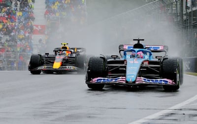 Alpine's Fernando Alonso and Red Bull's Sergio Perez during practice. Reuters
