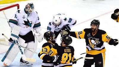 Nick Bonino #13 of the Pittsburgh Penguins celebrates with Phil Kessel #81 and Kris Letang #58 after scoring a third period goal against Martin Jones #31 of the San Jose Sharks in Game 1 of the 2016 NHL Stanley Cup Final at Consol Energy Center on May 30, 2016 in Pittsburgh, Pennsylvania. Matt Kincaid/Getty Images