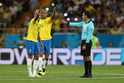 Neymar and Miranda argue with the referee Cesar Ramos, something Brazil manager Tite did not appreciate. Buda Mendes / Getty Images