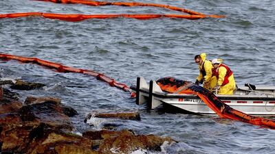 More than 750 people are working to resolve the oil spill. Thomas Shea / Getty Images / AFP