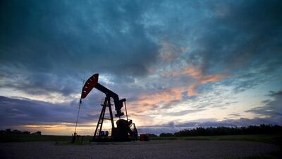 An oil derrick, a well head pump arm with frame, silhouetted against the evening sky. WTI closed last week at $41.74 per barrel. Mint Images