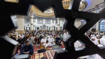 Devotees gather for Eid prayers at Al Farooq Omar Bin Al Khattab Mosque. Antonie Robertson / The National