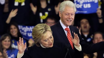 Democratic presidential candidate Hillary Clinton reacts as former President Bill Clinton smiles at her New Hampshire presidential primary campaign rally in Hooksett, New Hampshire. Elise Amendola / AP