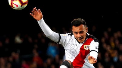 Barcelona's Arthur Melo vies for the ball with Rayo Vallecano's Alvaro Garcia. EPA