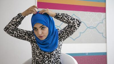 Step 2: Take the long side to the middle of the head keeping it as tight as possible and pin it in place.