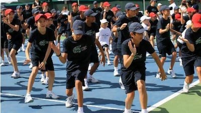 Volunteers get some exercise at the Dubai Duty Free Tennis Championships. Courtesy Dubai Duty Free