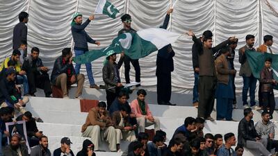 Fans at the pindi Cricket Stadium watch the first Test in Pakistan in a decade. AP