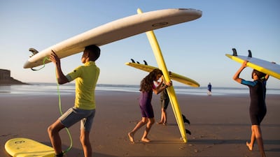 Students warm up during a surfing lesson in Tarfaya, Morocco. Reuters