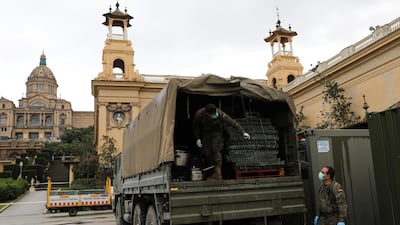 Members of the Logistics Brigade of the Spanish Army work to convert a Fira pavilion into a shelter center for homeless people in Barcelona. Reuters