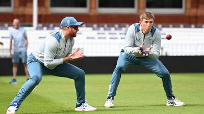 Zak Crawley of England catches as he is watched by Jonny Bairstow during a nets session at Lord's Cricket Ground on Wednesday. Getty