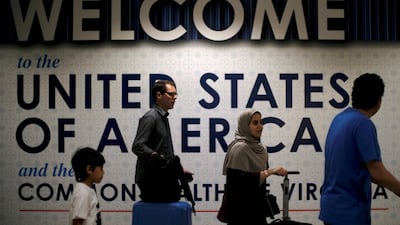 International passengers arrive at Washington Dulles International Airport after the US Supreme Court granted parts of the Trump administration's emergency request to put its travel ban into effect. James Lawler Duggan / Reuters