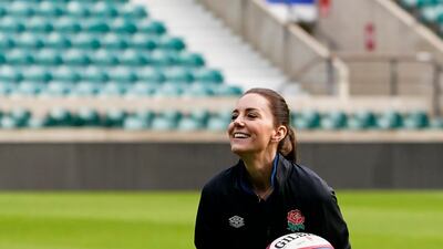 During the training, the Duchess of Cambridge also scored a try, threw the ball around and even practiced a scrum. AP Photo
