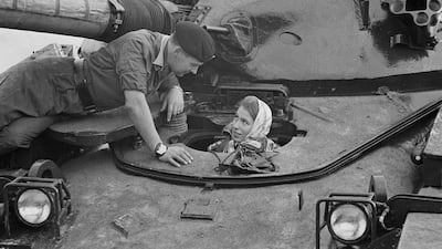 Princess Anne sits in a tank while visiting troops in Germany, in 1969.