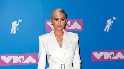 Kylie Jenner looks fabulous in Tom Ford, but also like a throwback photo of her momager Kris. Photo / EPA