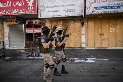 Armed Palestinians in the Jenin refugee camp, north of Hawara. AFP
