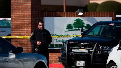 An officer stands near the scene after a church shooting at West Freeway Church of Christ on Sunday, Dec. 29, 2019 in White Settlement, Texas AP