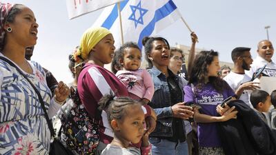 African migrants and Israelis demonstrate outside the Prime Minister's office in Jerusalem against the Israeli government's policy towards African refugees and asylum seekers. Menahem Kahana/ AFP Photo