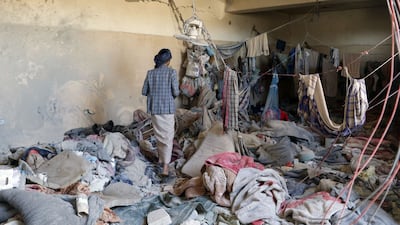 A Yemeni man inspects a site reported to be a prison destroyed in a Saudi-led air strike in the Houthi stronghold of Saada, northern Yemen, on January 27. AFP