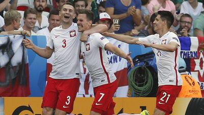 Poland players celebrate after Arkadiusz Milik scored their goal in a 1-0 victory over Northern Ireland on Sunday at Euro 2016. Sebastien Nogier / EPA / June 12, 2016