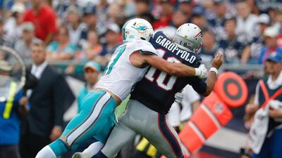 Miami Dolphins linebacker Kiko Alonso hits New England Patriots quarterback Jimmy Garoppolo on Sunday. CJ Gunther / EPA