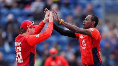 England's Jofra Archer, right, celebrates with Eoin Morgan after running out Pakistan's Babar Azam. Reuters