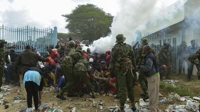 Kenyan police intervene outside the Kasarani stadium during a stampede as supporters of Kenya's president try to get into the venue to attend his inauguration ceremony on November 28, 2017. Simon Maina / AFP