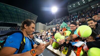 Rafael Nadal signs autographs for fans during the 2018 Mubadala World Tennis Championship in Abu Dhabi. Courtesy Flash Entertainment