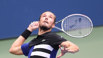Daniil Medvedev hits a serve to Andrey Rublev durring the US Open quarter-finals. AFP