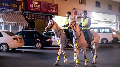 Police officers on horseback during a patrol in Dubai. Reem Mohammed / The National