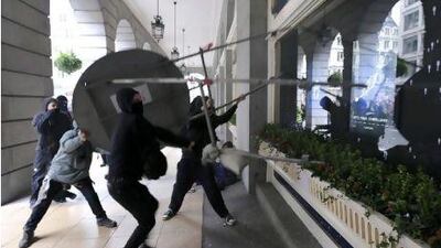 Protesters attack the Ritz Hotel in London after a march on Saturday against the UK government's austerity measures.