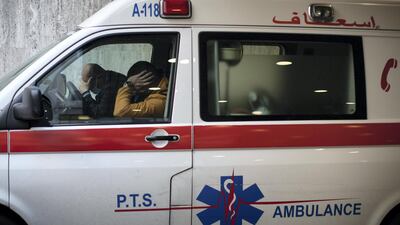 Paramedics rest in an ambulance parked outside the Emergency Department at the American University of Beirut (AUB) Hospital. Tom Nicholson for The National