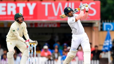 India's Umesh Yadav looksafter hitting a six. AFP