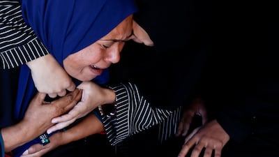 Women mourn Palestinians killed in an Israeli strike, at Nasser hospital in Khan Younis, southern Gaza. Reuters