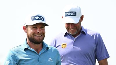 English pair Tyrrell Hatton Lee Westwood walk off the 9th green. Getty