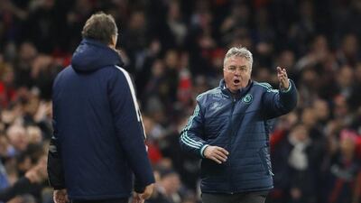 Chelsea manager Guus Hiddink, right, gestures towards PSG coach Laurent Blanc during their Uefa Champions League match at Stamford Bridge. Reuters / John Sibley