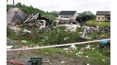 Wreckage of a Tu-134 plane, belonging to the RusAir airline, is seen on a highway near the city of Petrozavodsk early yesterday. The passenger jet crashed in heavy fog and burst into flames just short of a runway whose fog lights had failed. Ministry of Emergency Situations press service / AP Photo