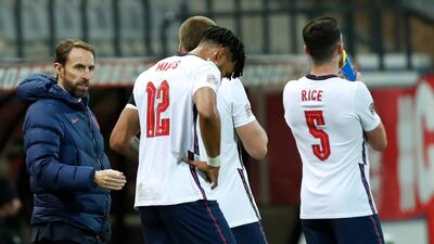 England manager Gareth Southgate talks to his players during the Nations League defeat in Belgium. AP