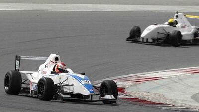 Haytham Sultan Al Ali goes past Nicolas Canal in Dubai for a podium finish.