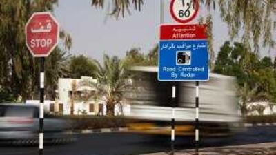 Motorists speed down Shakboot Ibn Sultan Street in Al Ain despite a sign warning that radar is used to enforce the speed limit.