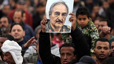 A man holds a poster of Khalifa Haftar during a rally last year demanding Mr Haftar take over, after a UN deal for a political solution missed what his supporters said was a self-imposed deadline. Esam Omran Al-Fetori / Reuters