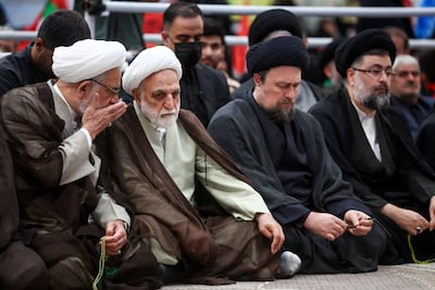 The hardliner head of Iran's judiciary, Gholam-Hossein Mohseni-Ejei, second left, has overseen a wartime crackdown on dissent. Reuters