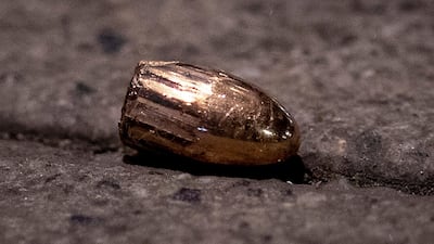 A projectile lies on the sidewalk near a restaurant at the scene of a shooting in central Hanau. AP