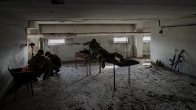 A sniper unit aims at Russian positions in the Kherson region during an operation in November 2022