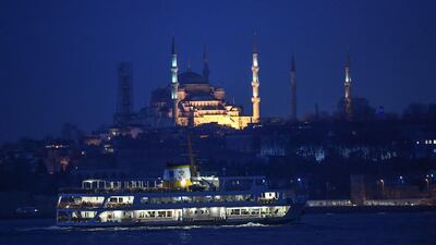 A ferryboat passes along the Bosphorus in the early morning as Sultanahmet mosque (know as blue mosque) is seen in the backround. AFP