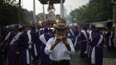 Members of Brotherhood Jesus of Nazareno participate in the procession of the Christs, in Izalco, El Salvador. EPA