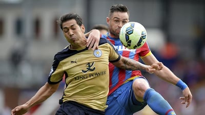 Leicester City's Leonardo Ulloa, left, and Crystal Palace's Damien Delaney battle for the ball during Palace's 2-0 win on Saturday at Selhurst Park. Andrew Matthews / PA / AP