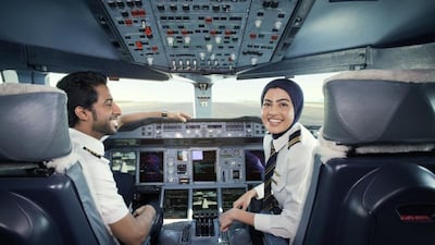 One of Emirate Airline's youngest pilots, Bakhita Al Muhairi, 23, an Emirati, is pictured in the cockpit alongside a colleague.