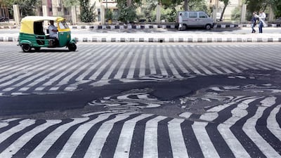 Road markings appear distorted during a heatwave in New Delhi. Harish Tyagi / EPA