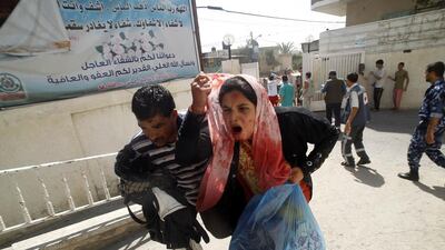 A wounded Palestinian woman arrives at Al Najar hospital in the southern Gaza strip after Israeli shelling of Rafah on August 1, 2014. Said Khatib / AFP